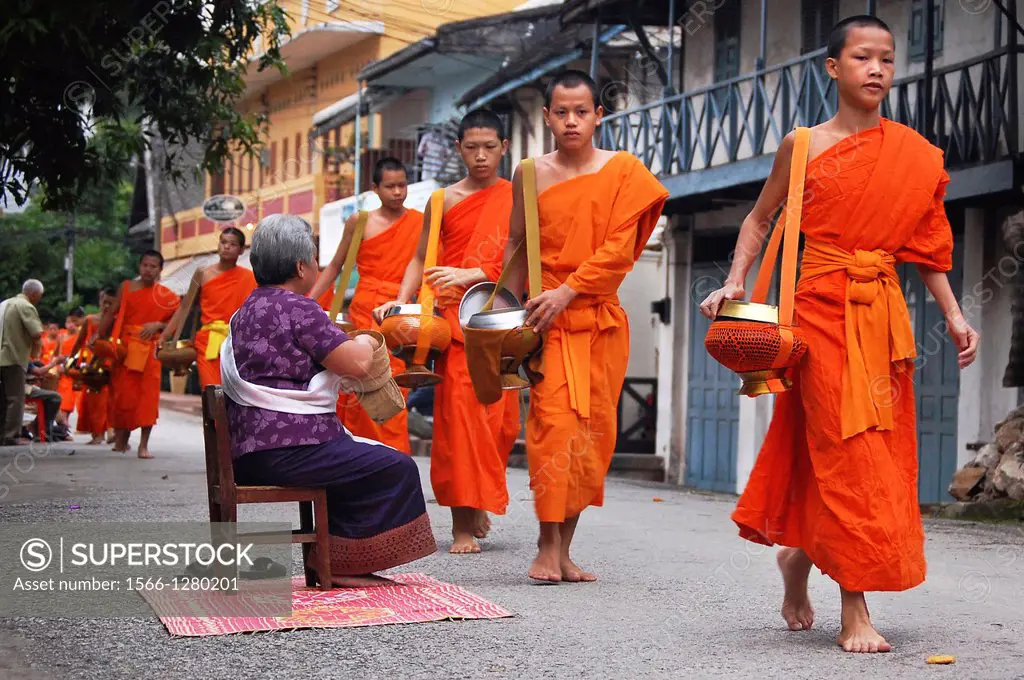 Early morning alms giving to the monks in Luang Prabang. Laos, Luang Prabang.