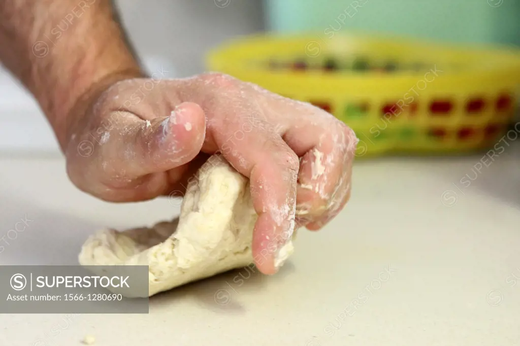 home made Cheese Focaccia kneading the dough.