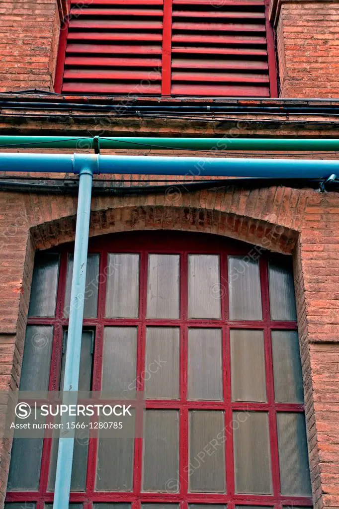window, industrial enclosure Can Batllo, Barcelona, Catalonia, Spain.