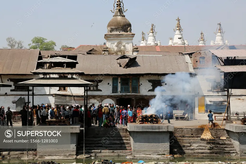 Nepal, City of Kathmandu, Pashupatinath hinduist temple, where dead people are cremated along a small river, ongoing cremation