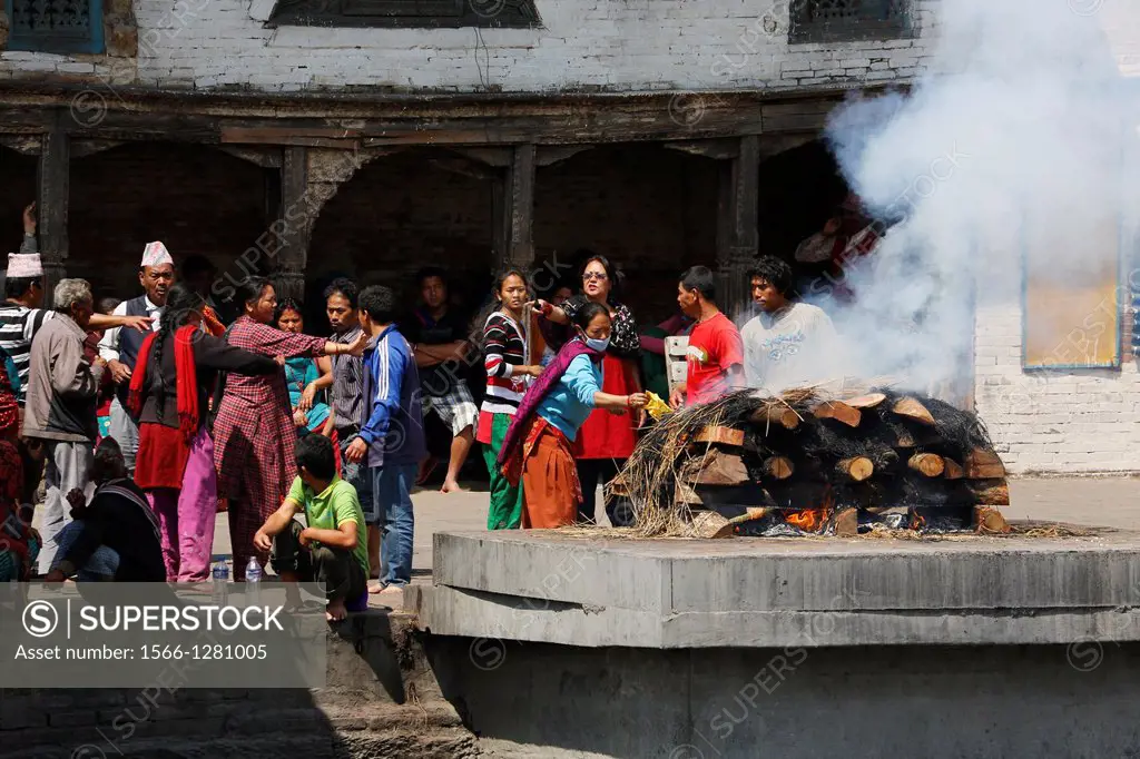 Nepal, City of Kathmandu, Pashupatinath hinduist temple, where dead people are cremated along a small river, ongoing cremation