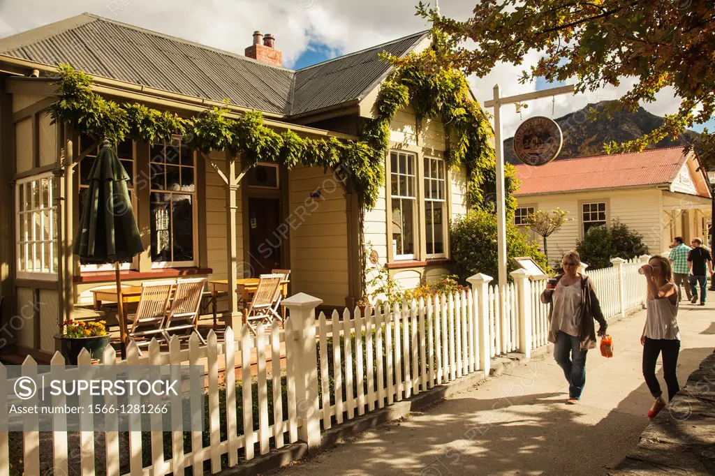 Arrowtown main street, historic Postmaster's residence, goldfields town now tourist resort, autumn, Otago, New Zealand,.