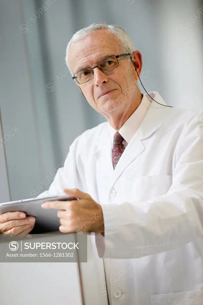 Doctor with tablet in corridor, Onkologikoa Hospital, Oncology Institute, Case Center for prevention, diagnosis and treatment of cancer, Donostia, San...