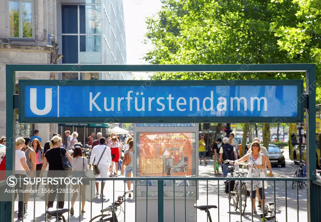 Kurfurstendamm metro sign, people in shopping street.
