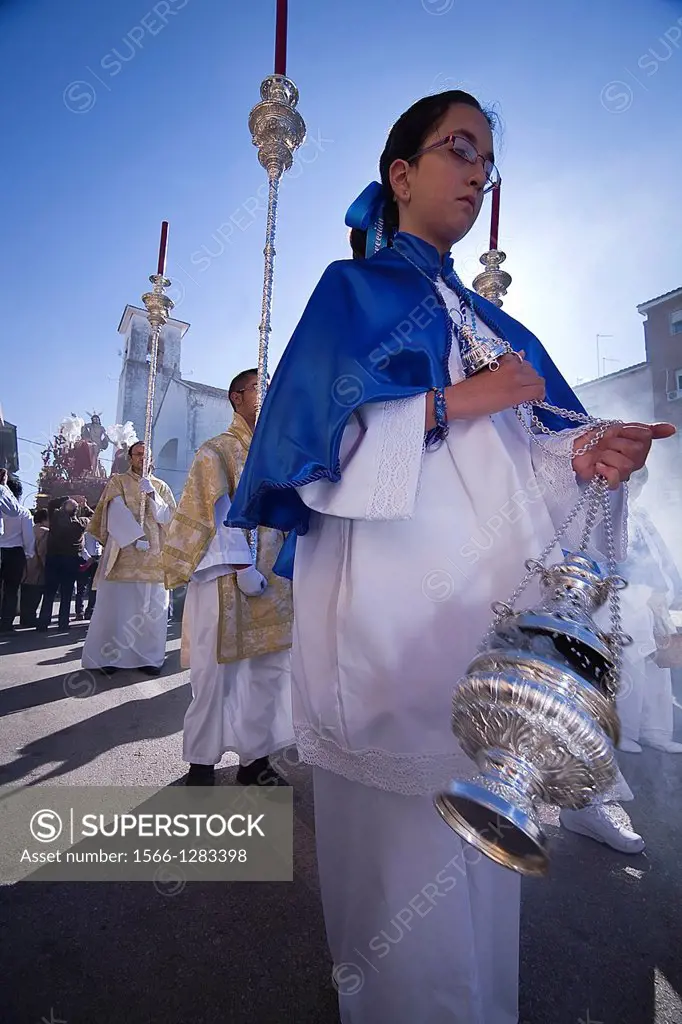 Young people in procession with incense burners in Holy week, Spain.
