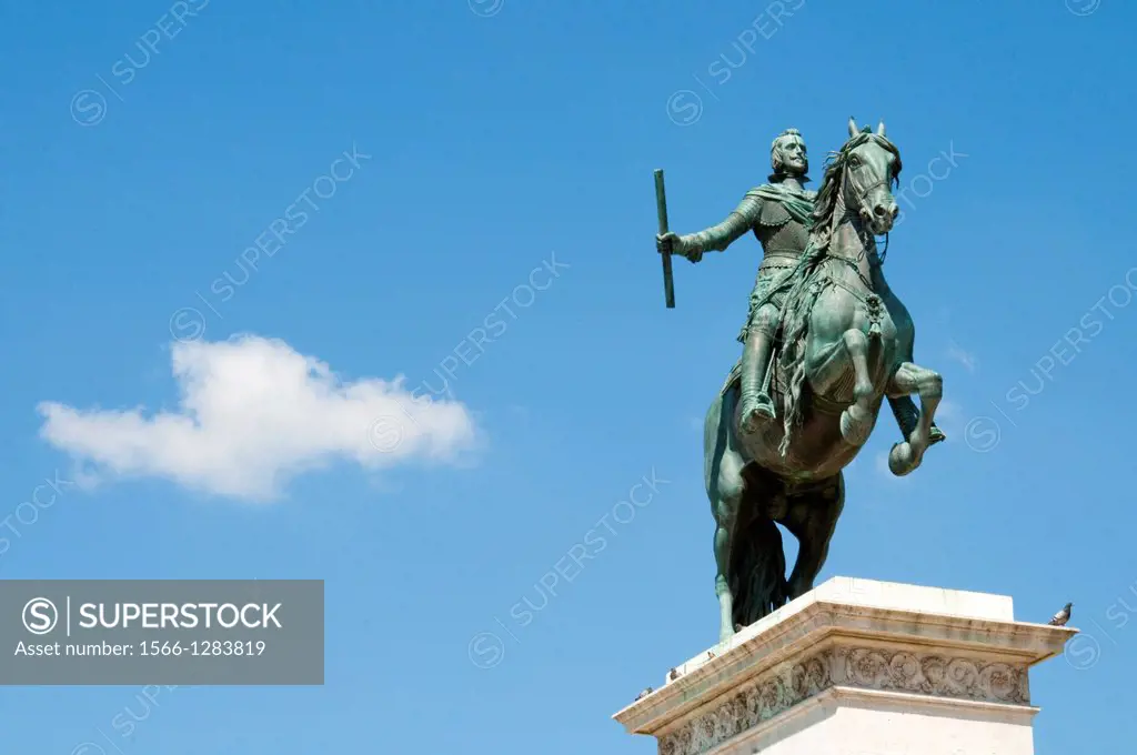 Felipe IV state against blue sky. Oriente Square, Madrid, Spain.