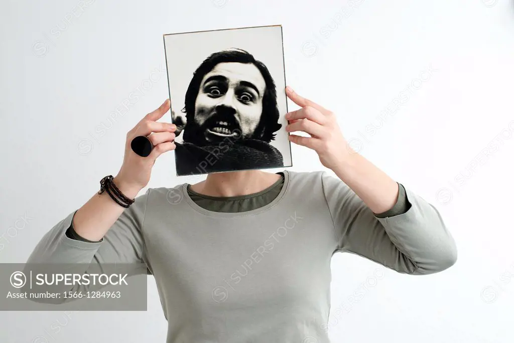 Woman with face covered with a photograph of a bearded man in black and white