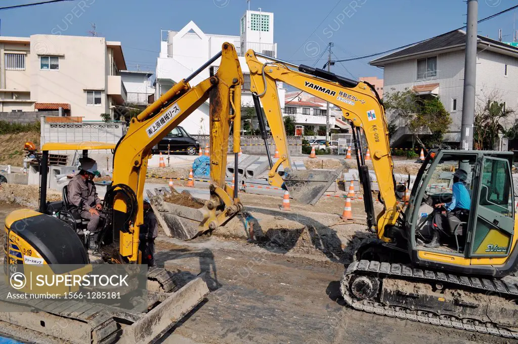 Naha, Okinawa, Japan, excavators fixing a road