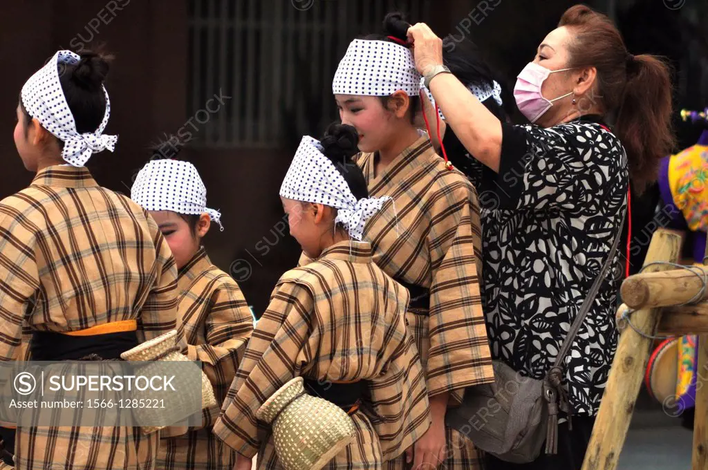 Naha, Okinawa, Japan, girls getting dressed before a traditional Okinawan dancing show in Tsuboya neighborhood