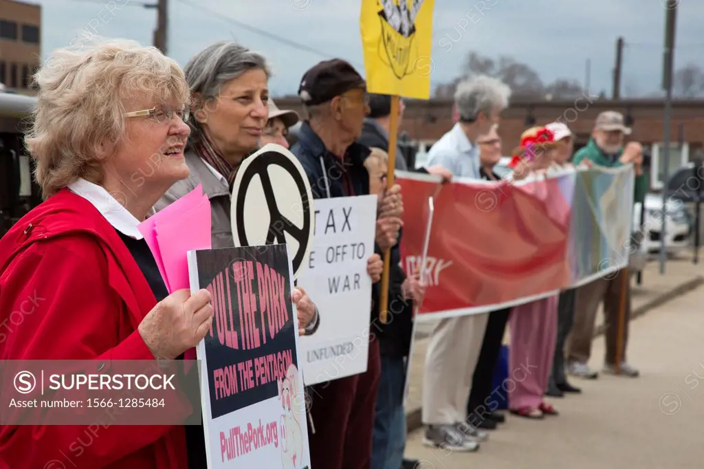 Royal Oak, Michigan - Members of Peace Action of Michigan rally in front of the Royal Oak post office as citizens are dropping their tax returns. They...