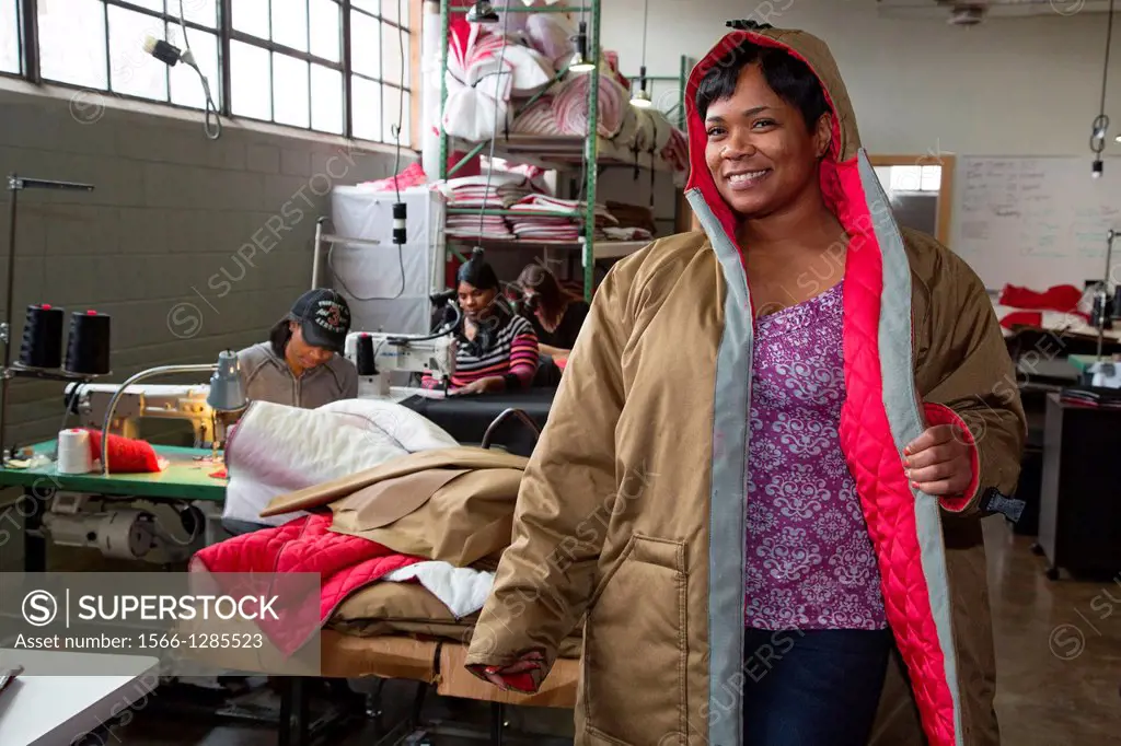Detroit, Michigan - A worker at the nonprofit Empowerment Plan models a coat which they are making for homeless people. The organization hires homeles...