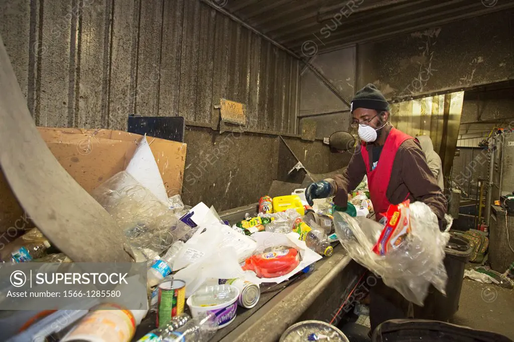 Troy, Michigan - Low-wage workers sort paper, glass, plastic, and metals for recycling at the Southeastern Oakland County Resource Recovery Authority....