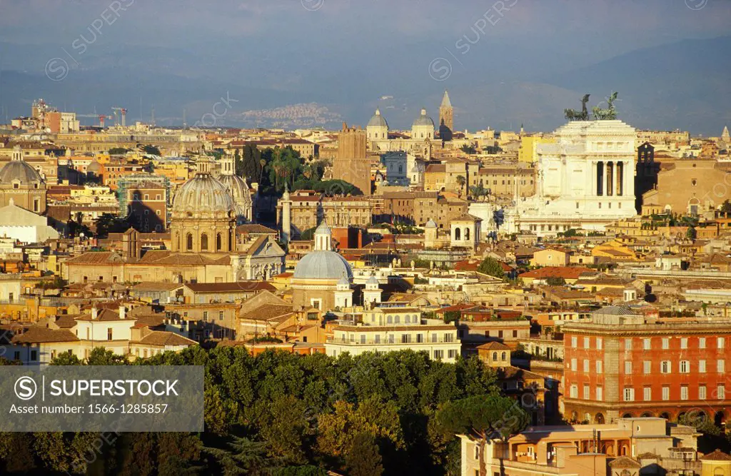 Rome, Italy. View across the city towards Piazza Venezia in golden evening light, from Piazza Garibaldi on the Gianicolo hill.
