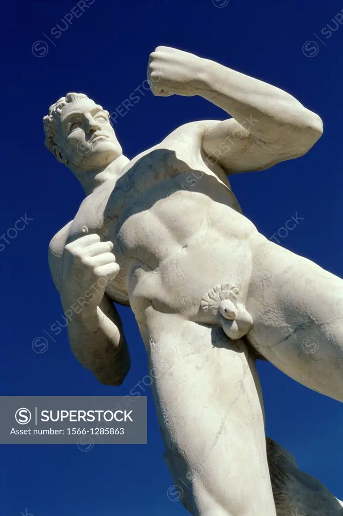Rome. Italy. Marble statues of naked male athletes in the fascist era Stadio dei Marmi, in the Foro Italico sports complex.