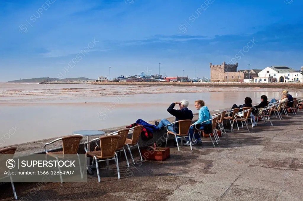 Morocco Essaouira Seafront café ´Chalet de la Plage´ with port beyond