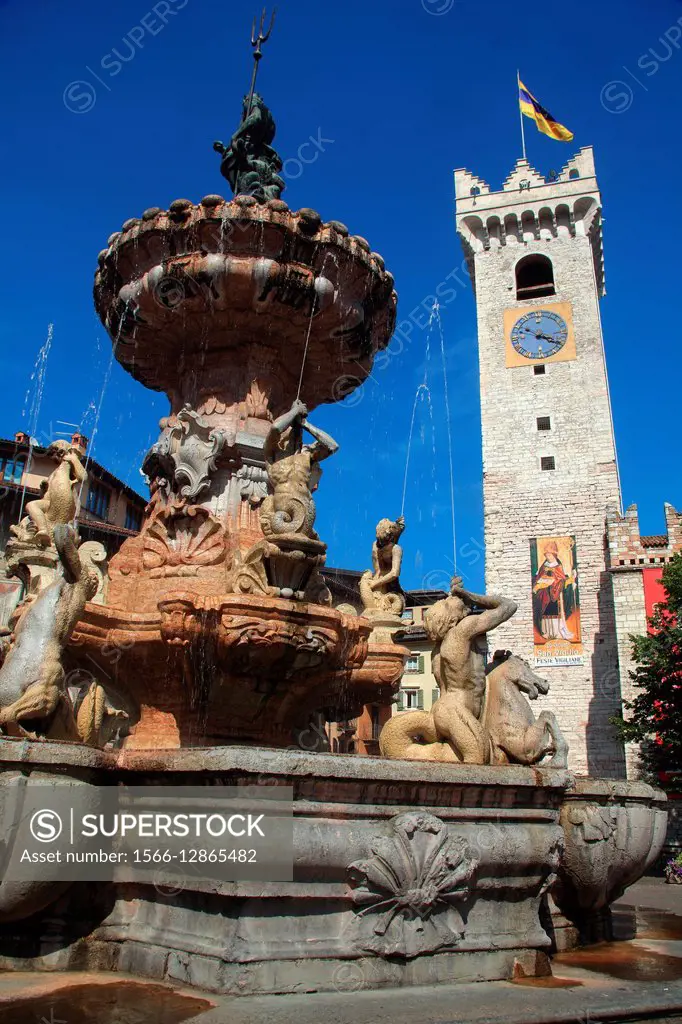 Neptune fountain and Civica tower in the Piazza Duomo. Trento. Italy.