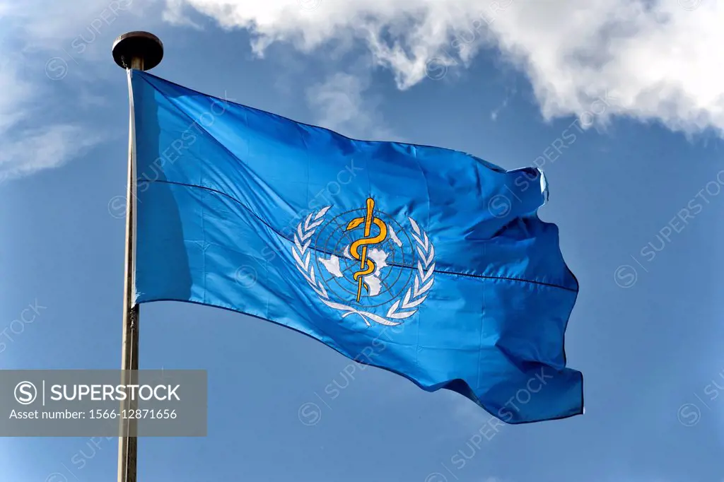 flag of WHO waving in front of W.H.O. - World Health Organization Headquarters in Geneva, Switzerland