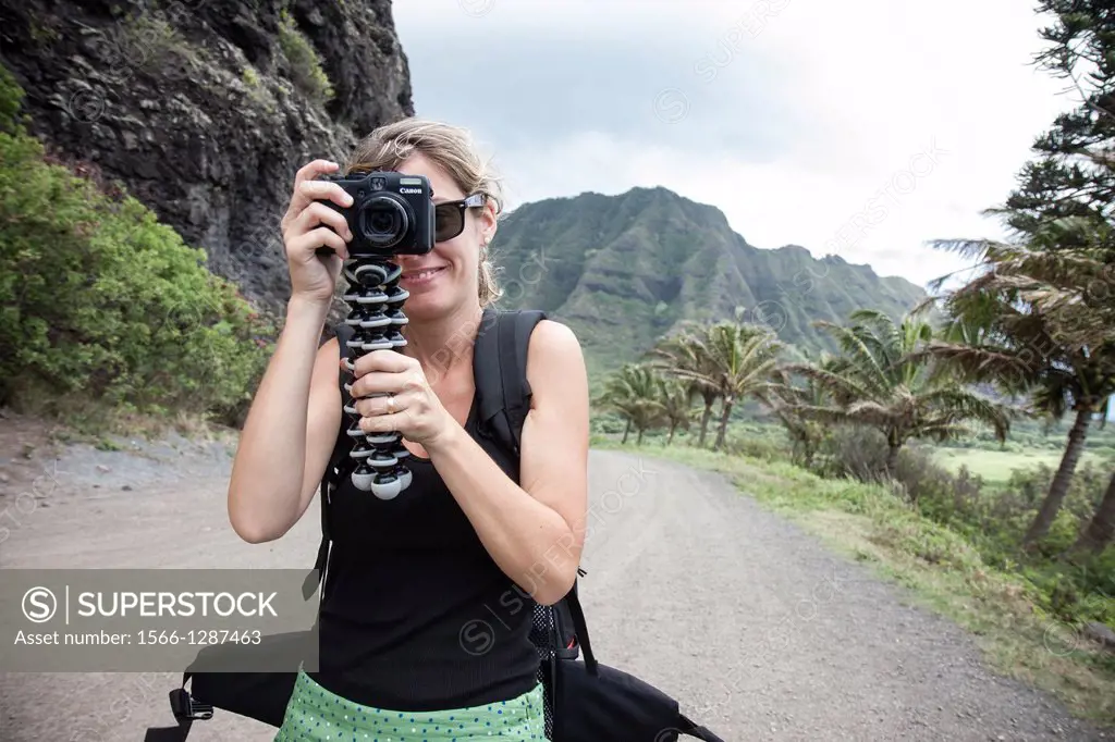 Tourist taking pictures, Oahu, Hawaii.