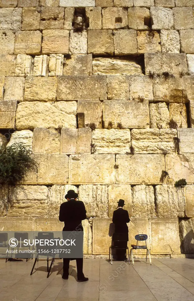Two praying jews at the Wall at Jerusalem, Israel