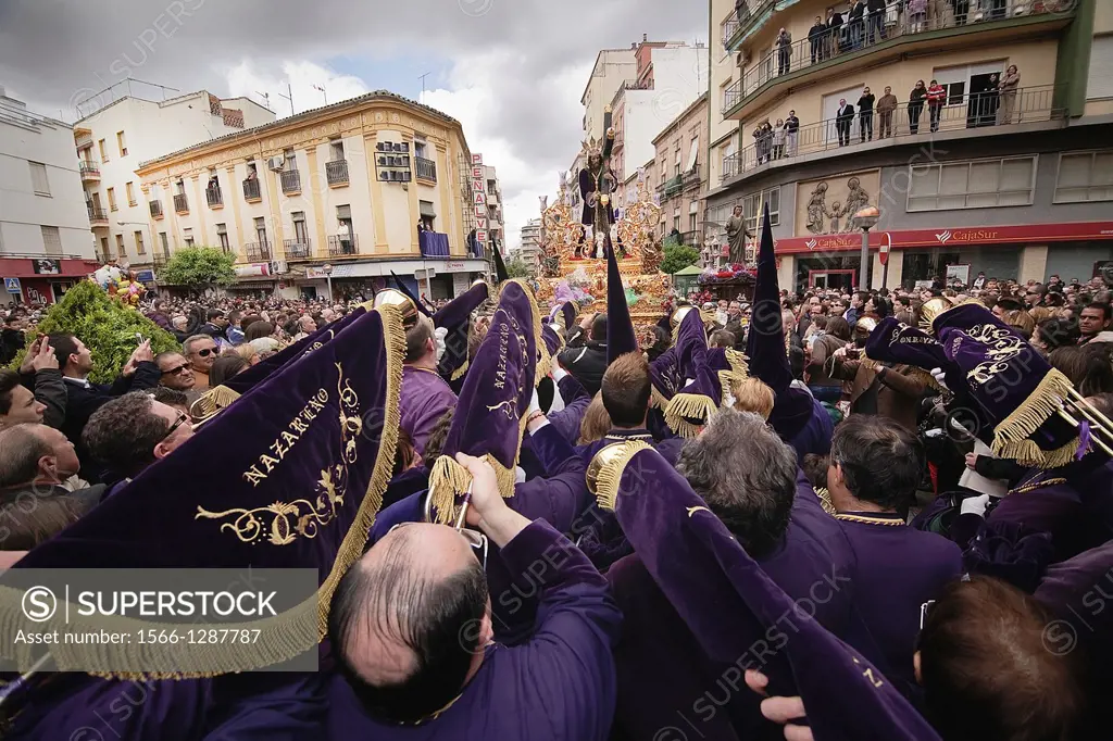 Penitents to playing their trumpets in a Holy week procession to the Nazarene, Holy Friday, Linares, Jaen province, Spain.