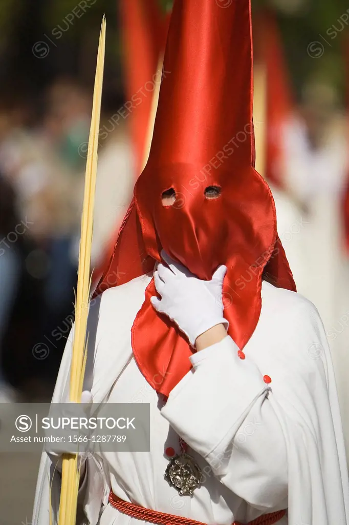 Detail penitent holding a palm during Holy Week, Spain.