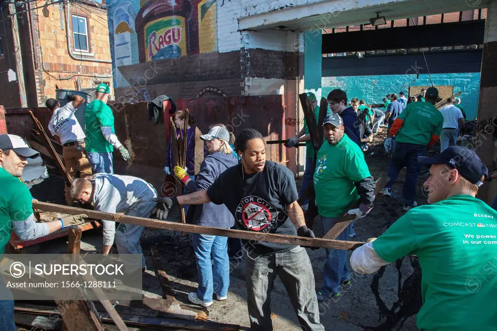 Detroit, Michigan - Volunteers from Comcast and Starbucks renovate a building for Motor City Blight Busters, an organization devoted to revitalizing t...