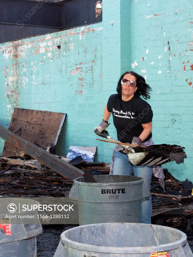 Detroit, Michigan - Volunteers from Comcast and Starbucks renovate a building for Motor City Blight Busters, an organization devoted to revitalizing t...
