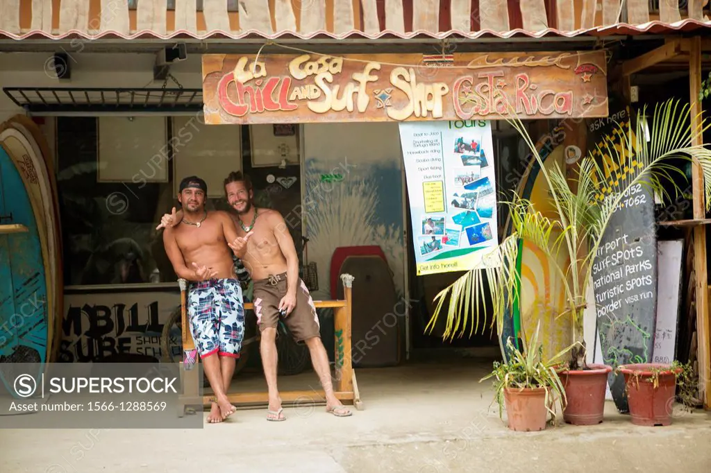 Surfers in front of Surf shop, Costa Rica.