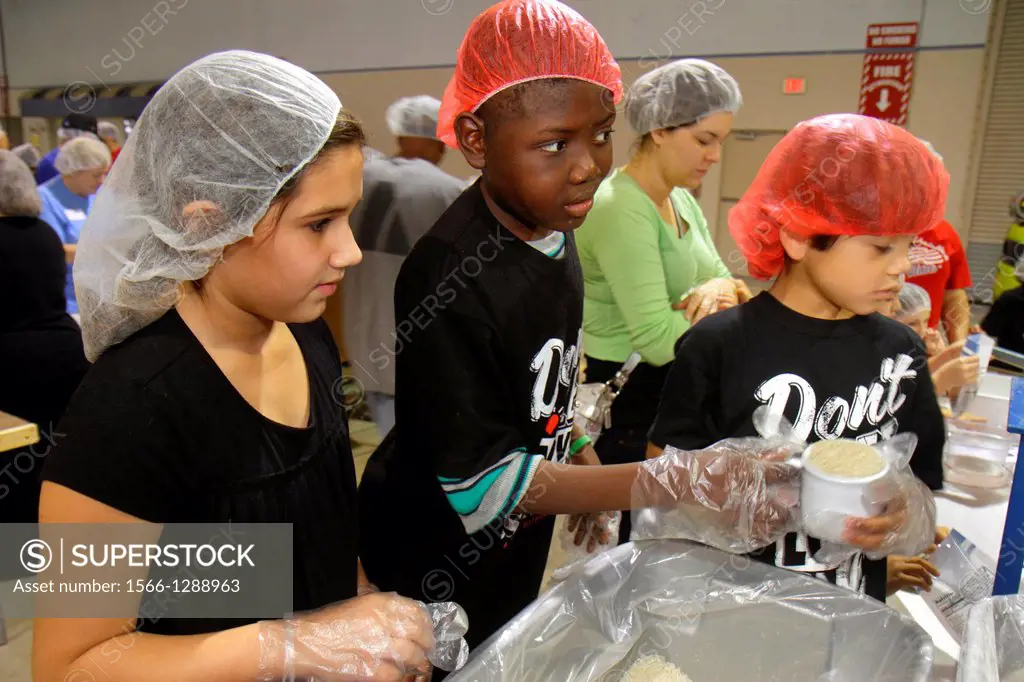 Florida, Miami, Miami-Dade County Fair And Expo, Feed My Starving Children, volunteer, community service, packing, meals, Hispanic, girl, student, boy...