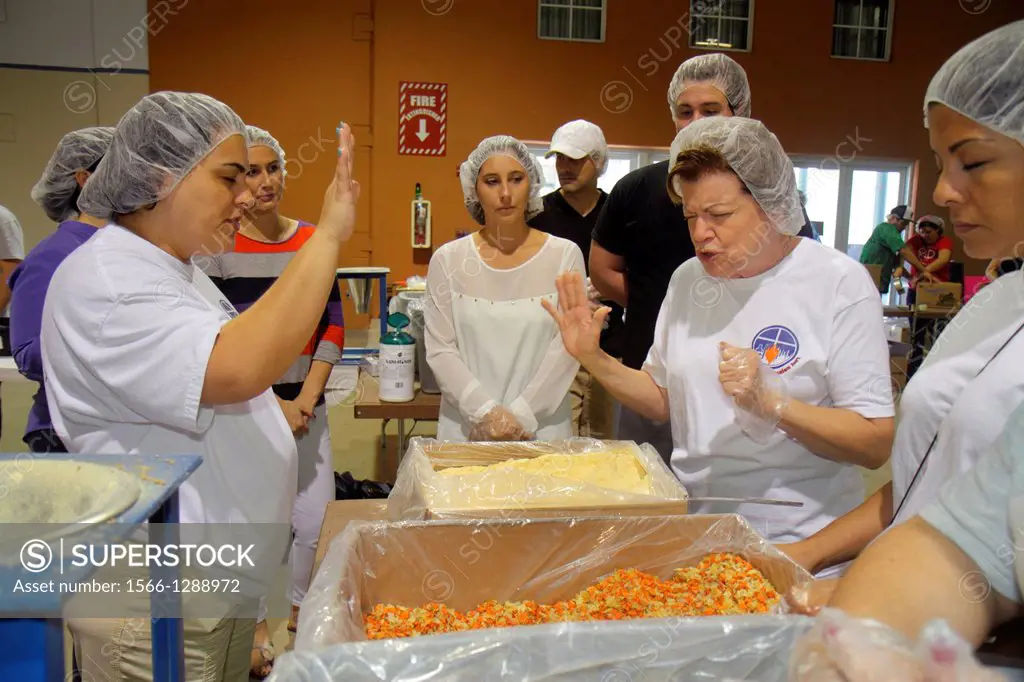 Florida, Miami, Miami-Dade County Fair And Expo, Feed My Starving Children, volunteer, community service, packing, meals, hairnet, Hispanic, woman, se...