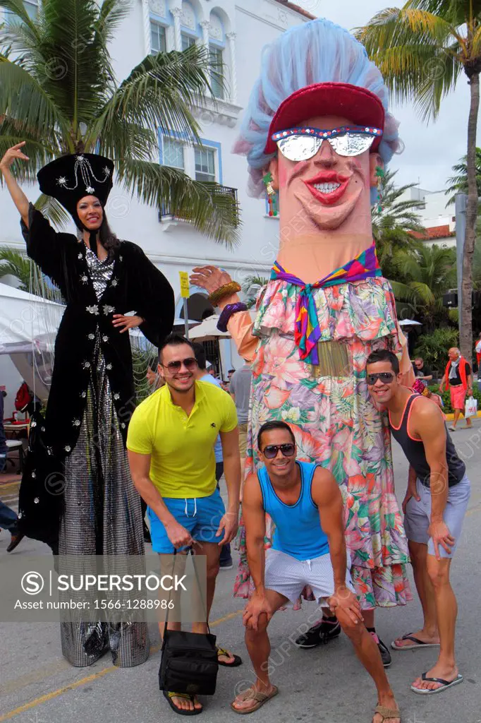 Florida, Miami Beach, Ocean Drive, Art Deco Weekend, festival, event, paper mache, character, man, posing, for picture,.