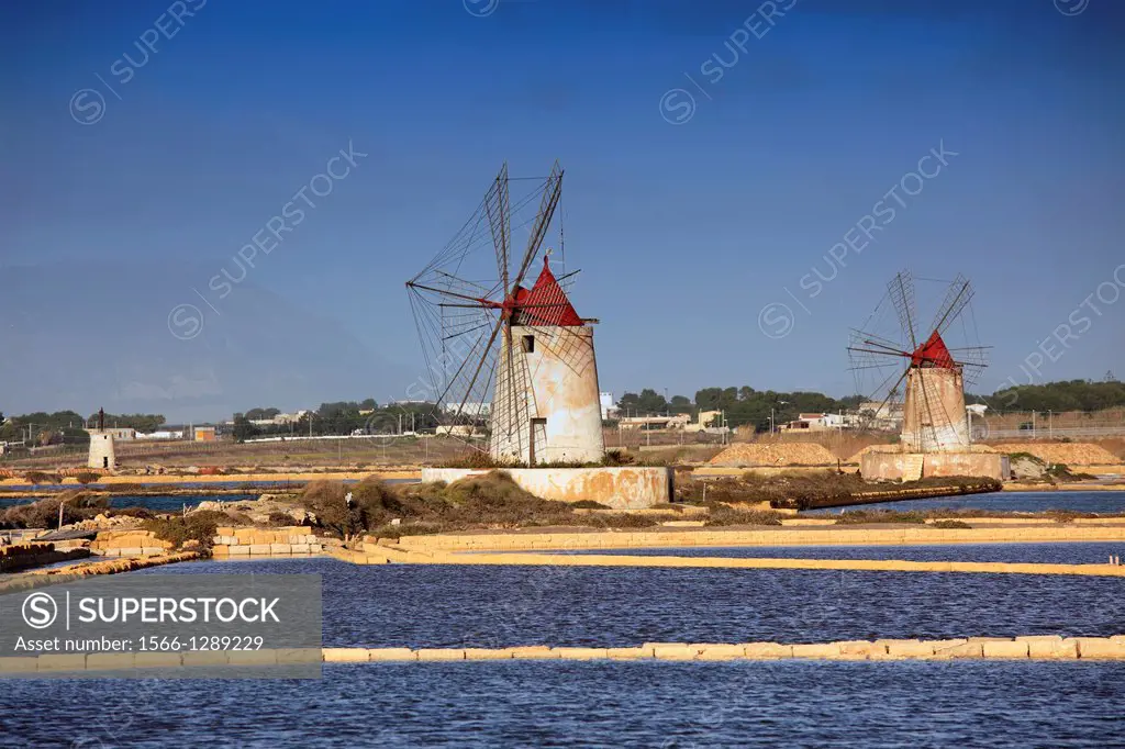 Windmills at Salt Pans in Trapani, Sicily, Italy.