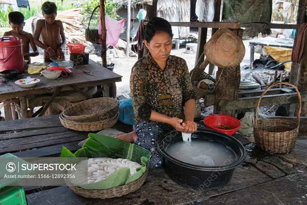 Making handmade rice flour noodles, Siem Reap, Cambodia.