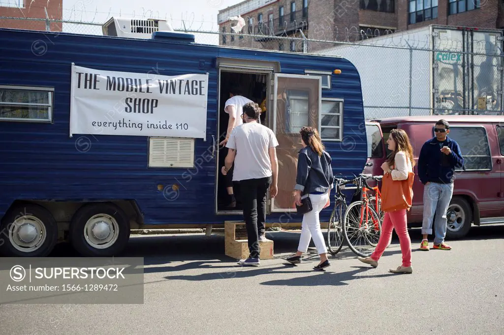 Customers enter The Mobile Vintage Shop in the Bushwick neighborhood of Brooklyn in New York. The neighborhood is undergoing gentrification changing f...