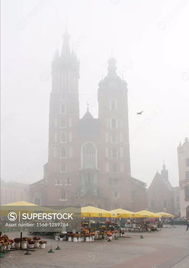 Main Market Square and St Marys Basilica in Krakow, Poland.