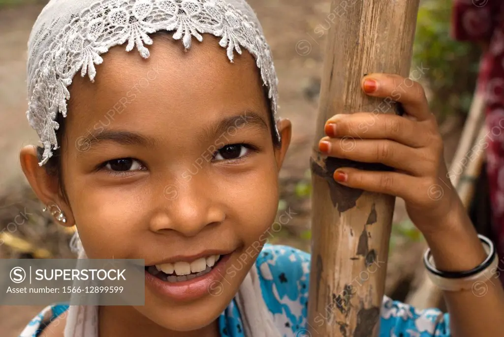 Portrait of a girl near Phong Dien. Mekong Delta. Vietnam South Mekong Delta Chau Doc Cham Moslem village face of happy village girl with beaming smil...