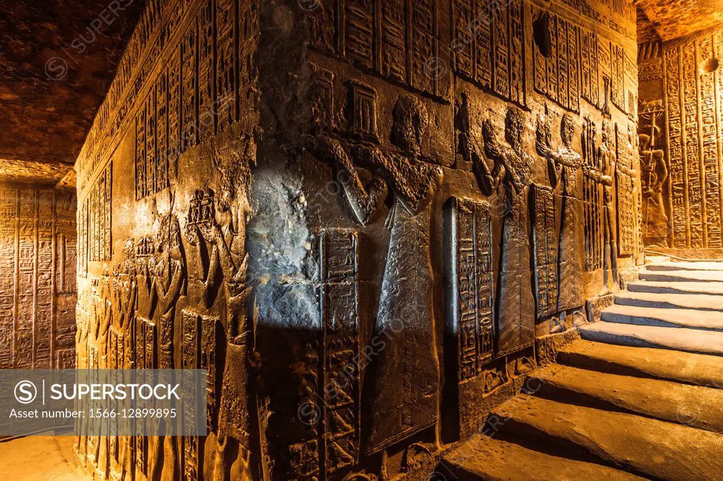 Reliefs at an interior stairway at the Temple of Hathor in Dendera. Qena, Egypt.