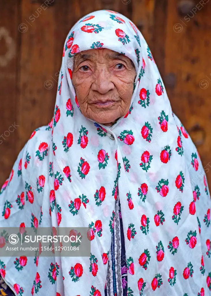 Portrait Of An Iranian Woman Wearing Traditional Floreal Chador In Zoroastrian Village, Isfahan Province, Abyaneh, Iran.
