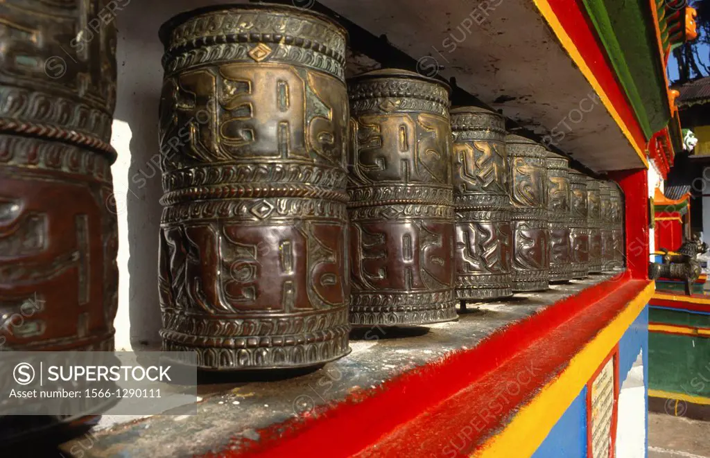 row of prayer wheels at monastery at Gum, Sikkim, India