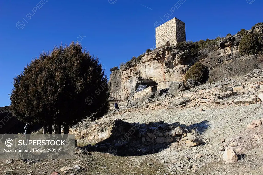 Entrance to the Cave of the Casares rock carvings and Arab watchtower. Riba de Saelices, Guadalajara, Spain.