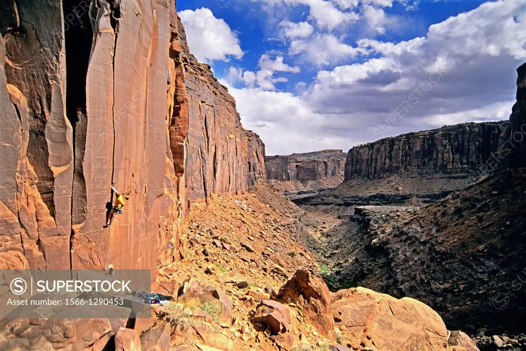 Rock climbing a route called Nina which is rated 5,10 and located in Long Canyon near the town of Moab in southern Utah.