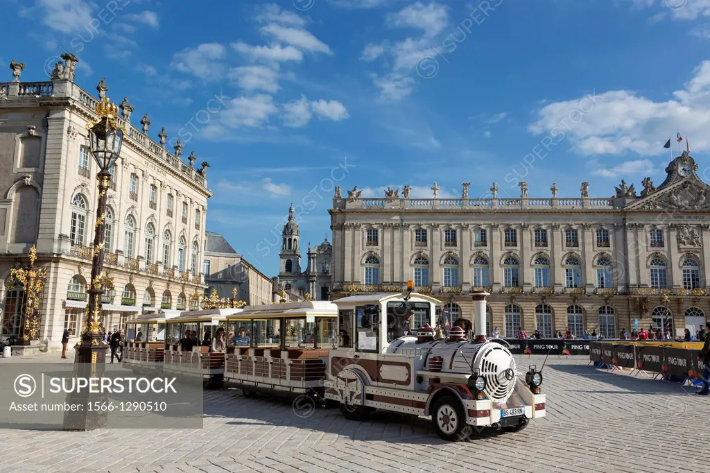 Place Stanislas with town hall and tourist train, Nancy, Meurthe-et-Moselle, France.