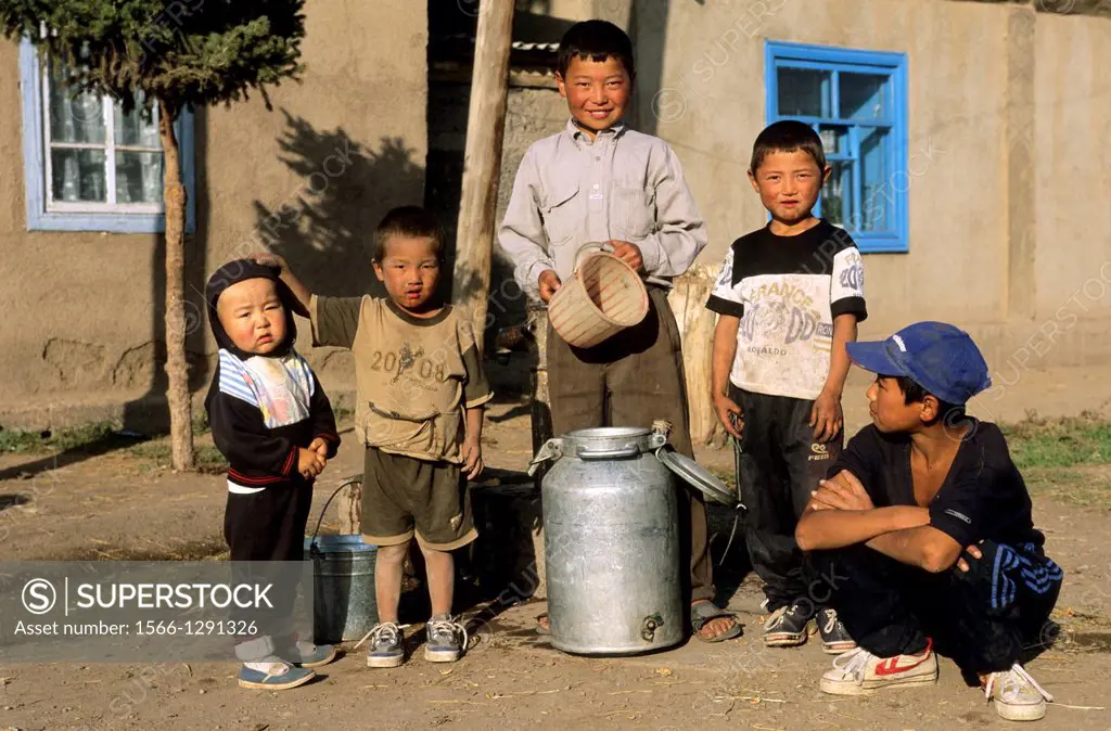 Local People and Kids; Issyk Kul Lake; Kyrgyzstan; milk jug; poor people.