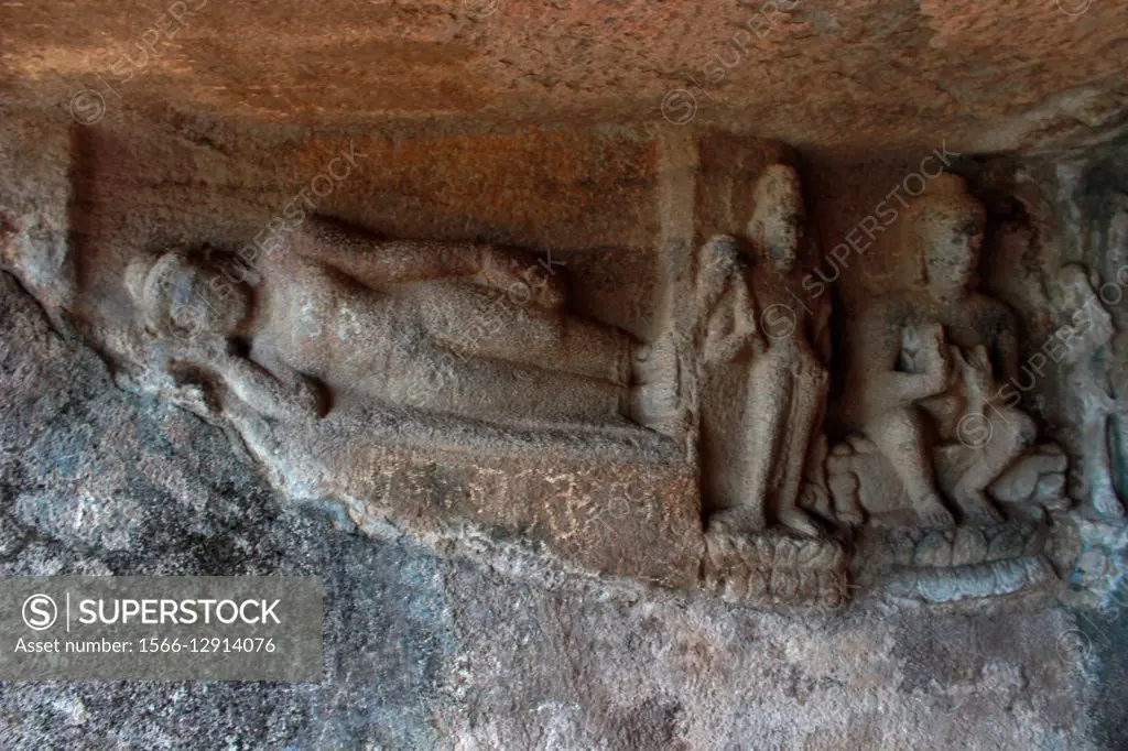 Sleeping Buddha and other images Pandavleni Buddhist caves. Nasik, Maharashtra, India.
