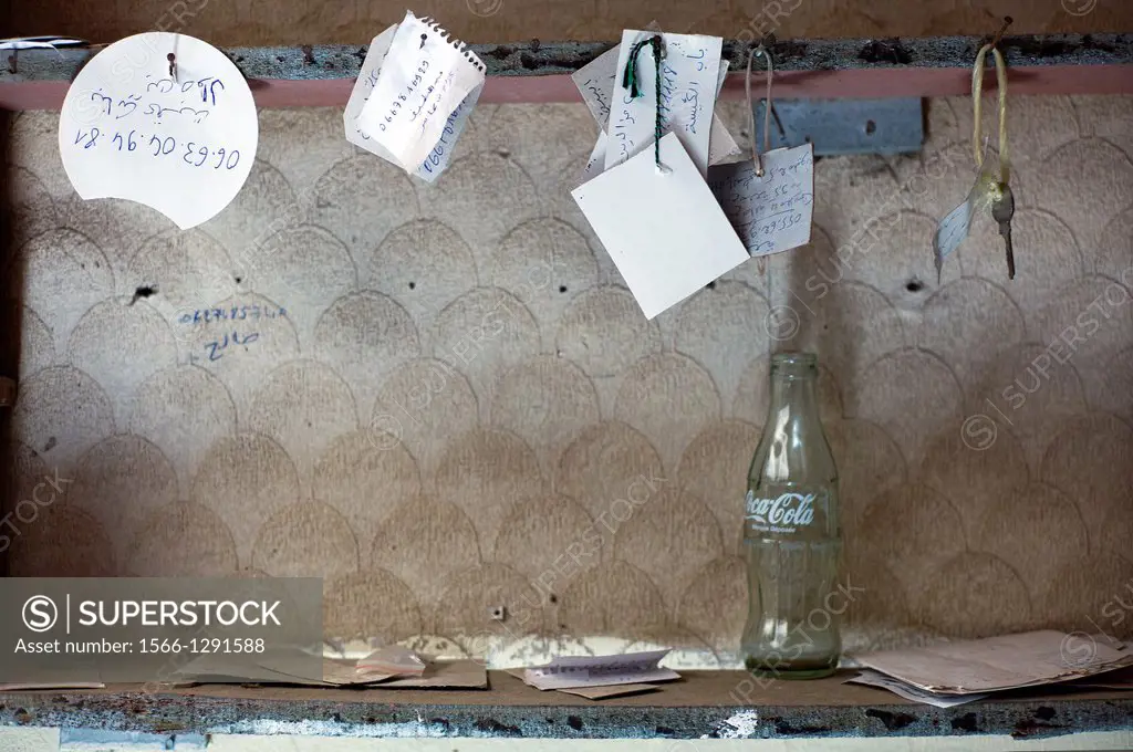 several handwritten notes and keys hanging on a wall. Fez, Morocco, Africa