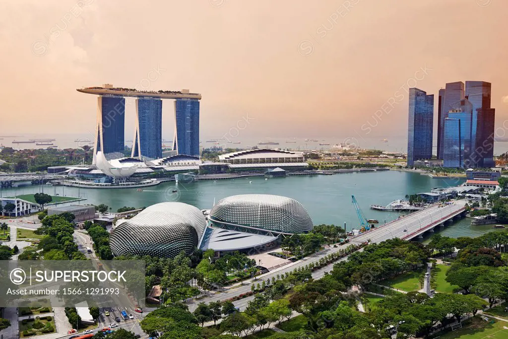 Aerial view of Marina Bay. In foreground the Esplanade Theatre, on the background the tall towers of Marina Bay Sands. On the right hand side the skys...