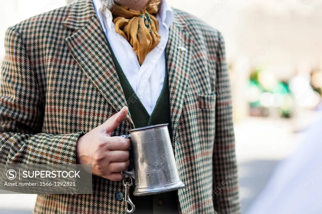Fashion man holding an old beer mug, Deptford Jack, London, UK