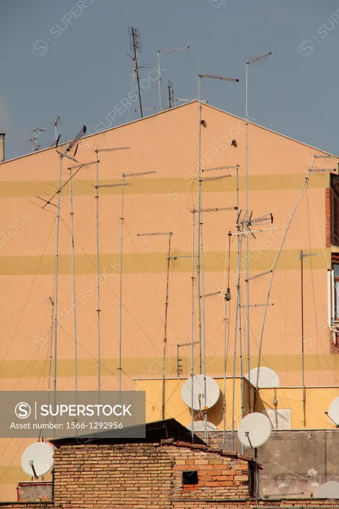 lots of television aerials on building roof in rome italy