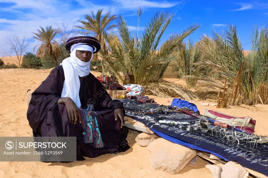 Tuareg is waiting for Tourits; Lake Mandara; Libyan Arab Jamahiriya; Libyan Desert.