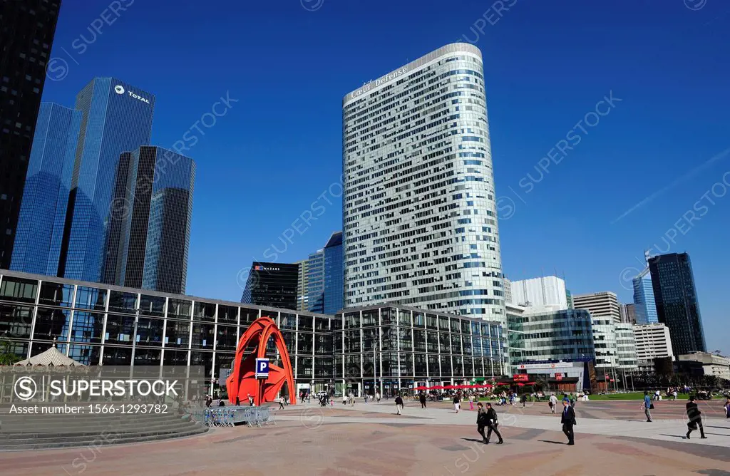 Businessmen walking in the main square of La Defense district in the westernmost part of Paris,France,Europe.